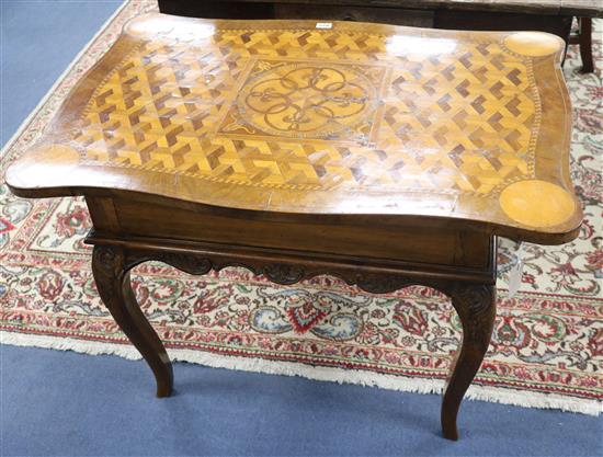 A German parquetry top carved table W.93cm